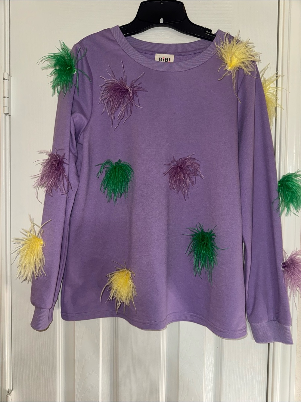 BiBi Lilac Sweatshirt with Green, Yellow, and Purple Feather Poms